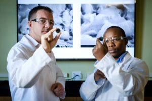 Principal investigator Michael D. Gross, Ph.D. (pictured above, left) and Sixbert P. Muhoza, Ph.D., (right) postdoctoral research scientist